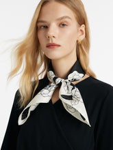 A lady wears a silk scarf.